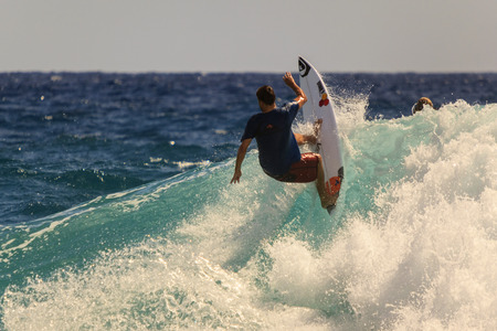 SNAPPER ROCKS, GOLD COAST, AUSTRALIA - 5 MARCH  Unidentified Surfer races the Quiksilver   Roxy Pro...