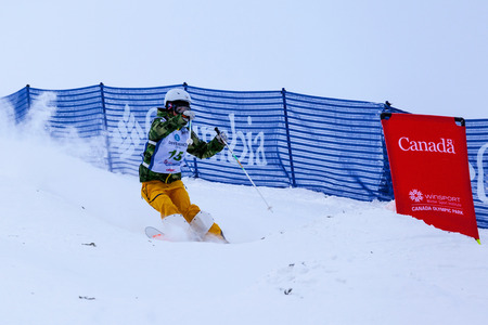 CALGARY CANADA JAN 2 2015. FIS Freestyle Ski World Cup, Winsport, Calgary Unidentified contender practicing on the slope at the Mogul Free Style World Cup on race day.のeditorial素材