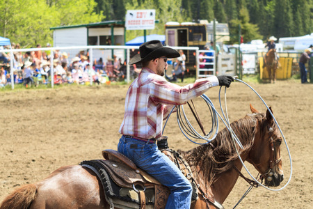 WATER VALLEY, CANADA-JUN 6 2015:Unidentified Cowboy participating in the at the Bareback Bronco Water Valley Rodeo. This annual event is important for the rural as well as the sport loving community.のeditorial素材