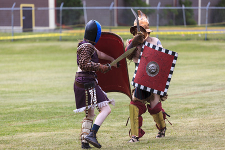 CALGARY CANADA JUN 13 2015: The Military Museum organized "Summer Skirmish" event where an unidentified soldier is seen in a historical Reenactment Battle. Gladiator fight.のeditorial素材