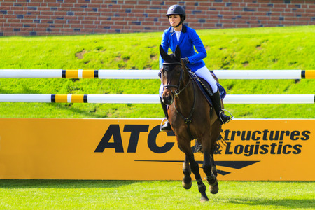 CALGARY CANADA - JUN 7 2015: Unidentified rider in action during the prestige's Spruce Meadows International hors jumping competition,  riders comes all over the world to compete.のeditorial素材