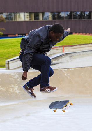 CALGARY, CANADA - JUN 21, 2015: Athletes have a friendly skateboard competition in Calgary. California law requires anyone under the age of 18 to wear a helmet while riding a skateboard.のeditorial素材