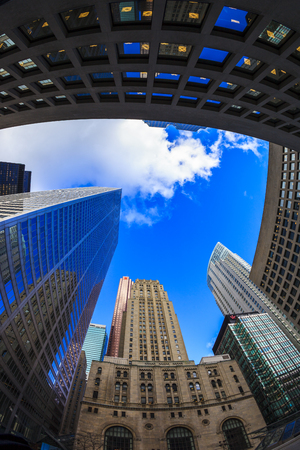 TORONTO CANADA 16-10-2015:Office buildings stretch up to the blue sky in the financial district in downtown. Toronto has prominent buildings in a variety of styles by many famous architects.