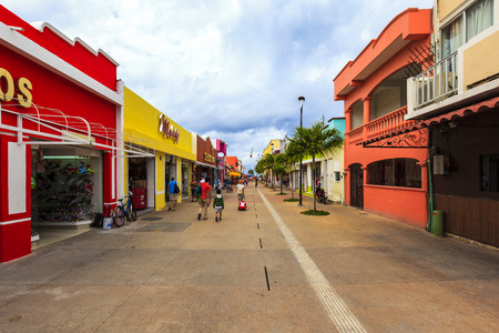 COZUMEL MEXICO JAN 26 2016:Colorful souvenir, coffee shops located in town. Tourists can buy various souvenirs as a memory about beautiful Tropical Island. The economy of Cozumel is based on tourism.のeditorial素材