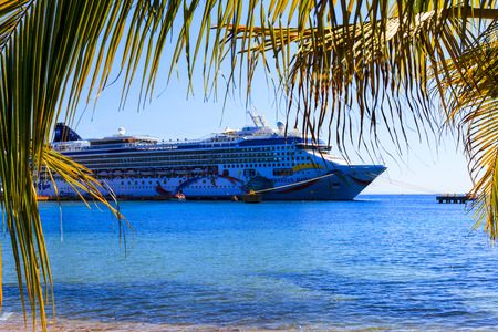 ROATAN ILAND HONDURAS JAN 28 2016:Ctruise ships docked near the bay at Coxen Hole, Roatan Town, with a population of 5,070, Favorite spot for cruise ships and tropical lover vacationersのeditorial素材