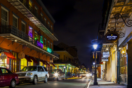 NEW ORLEANS, LOUISIANA USA- JAN 23 2016: Pubs and Bars having colorful lights and decorations in the French Quarter. Tourism provides a much needed financial source, also home for great musicians.のeditorial素材