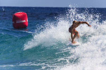SNAPPER ROCKS, GOLD COAST, AUSTRALIA - MARCH 2, Unidentified Surfer races the Quiksilver & Roxy Pro World Title Event. March 2, 2014, Snapper Rocks, Gold Coast, Australiaのeditorial素材