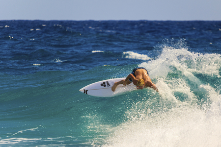SNAPPER ROCKS, GOLD COAST, AUSTRALIA - MARCH 2, Unidentified Surfer races the Quiksilver & Roxy Pro World Title Event. March 2, 2014, Snapper Rocks, Gold Coast, Australiaのeditorial素材