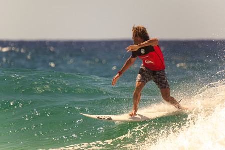 SNAPPER ROCKS, GOLD COAST, AUSTRALIA - MARCH 2, Unidentified Surfer races the Quiksilver & Roxy Pro World Title Event. March 2, 2014, Snapper Rocks, Gold Coast, Australiaのeditorial素材