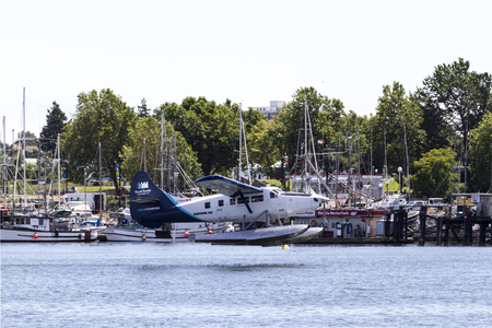 VICTORIA, BC, CANADA - JUN 30 2016: Float-plane traffic in the inner harbor. This transportation is...