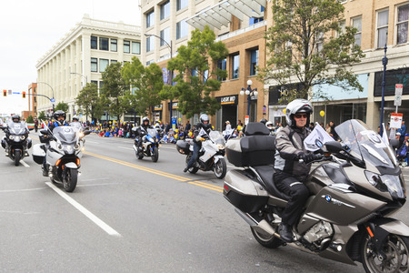 VICTORIA,BC,CANADA-MAY 23,2016: People and Organizations from Canada and USA in the Victoria Day parade along Douglas Street. This is Victoria's largest parade, attracting well over 100,000 people..のeditorial素材