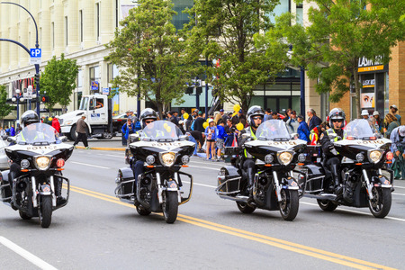 VICTORIA,BC,CANADA-MAY 23,2016: People, Organizations from Canada and USA in the Victoria Day parade...