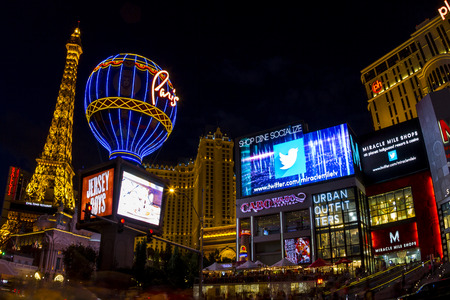 LAS VEGAS, USA - JULY 7 2015: Hotel Paris with half scale, 541-foot (165 m) tall replica of the Eiffel Tower at twilight in Las Vegas, Nevada. About 40 million people visiting the city each year.のeditorial素材