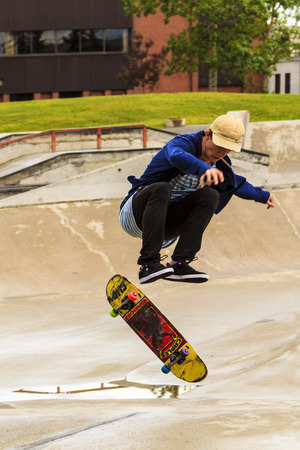 CALGARY, CANADA - JUN 21, 2015: Athletes have a friendly skateboard Show Off in Calgary. California law requires anyone under the age of 18 to wear a helmet while riding a skateboard.のeditorial素材