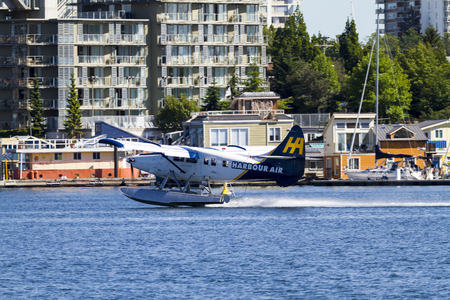 VICTORIA, BC, CANADA - JUN 24 2016: Royals Victoria Float-plane in the inner harbor. This transportation is vital and very frequent between Vitoria and Vancouver, also the flight is very pictures.のeditorial素材