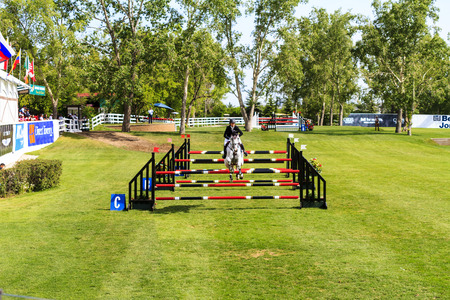 CALGARY, CANADA-JUN 9 : Unknown rider on a horse during 2015, INTERNATIONAL Race on Jun 09 , 2015 at Calgary Show Jumping Horse Race Course in Calgaryのeditorial素材
