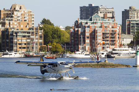 VICTORIA, BC, CANADA - JULY 24 2016: Float-plane traffic in the inner harbor. This transportation is...