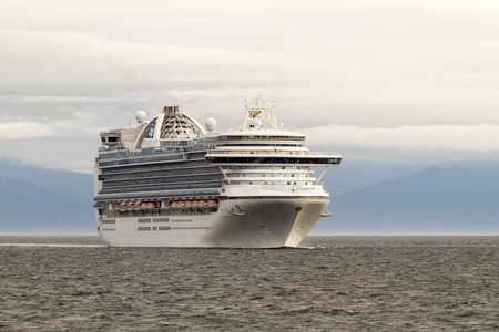 VICTORIA, BC, CANADA - JULY 21 2016. Cruise ship in Victoria. Each year hundreds of cruise ships docks in for a day or two. Victoria's charm and beauty has a lot to offer for any world traveler.のeditorial素材