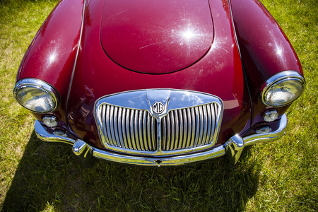 WINGS & WHEELS CALGARY CANADA 21 6 2015:Father's Day Weekend where some vintage Cars and Aircrafts on display. A Burgundy MG on display.のeditorial素材