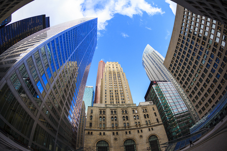 TORONTO CANADA 16-10-2015:Office buildings stretch up to the blue sky in the financial district in downtown. Toronto has prominent buildings in a variety of styles by many famous architects.のeditorial素材