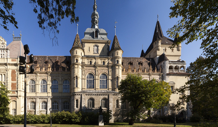 BUDAPEST HUNGARY SEPT 26 2016: Vajdahunyad Castle. People are passing by building of agricultural museum inside complex of Vajdahunyad Castle. Visitors enjoy the historical schinery all year aroundのeditorial素材
