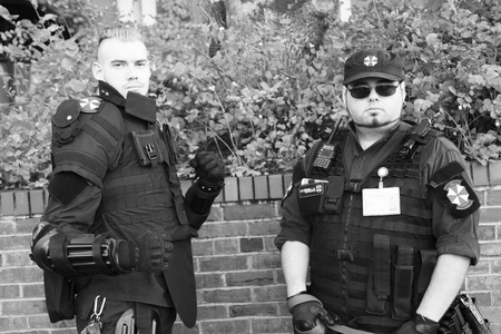 VICTORIA CANADA OCT 29 2016: Zombies takes over Victoria. Young people in costumes participating. Zombie Walk is an annual event, Zombie Patrol dressed as a soldier, guard the civilians from zombies.のeditorial素材