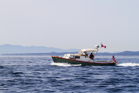 VICTORIA BC CANADA SEPT 3 2017: Vintage boat sails on the Victoria Classic Boat Festival. This vintage boat took part of the Annual Sail Day Event.のeditorial素材