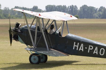 Dunakeszi Hungary Jun 8 2019: An antique Hungarian built biplane and a monoplane are on the tarmac.のeditorial素材