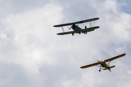 Dunakeszi Hungary Jun 8 2019: An antique Hungarian built biplane and a monoplane are bypassing in...