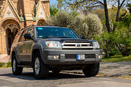 Budapest Hungary April 13, 2010: A Toyota 4Runner parked in front of a Churche on sunny morning.