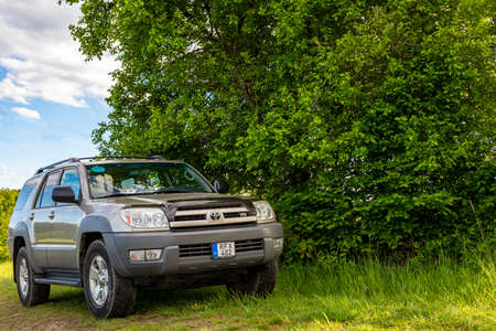 Hungary Central mountain region May 1, 2020: Toyota 4Runner SUV touring along in the forestry...