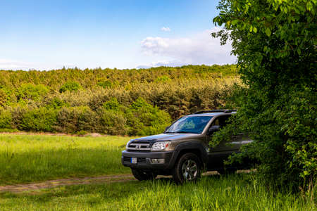 Hungary Central mountain region May 1, 2020: Toyota 4Runner SUV touring along in the forestry tracks.のeditorial素材