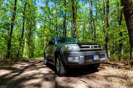 Hungary Central mountain region May 1, 2020: Toyota 4Runner SUV touring along in the forestry...