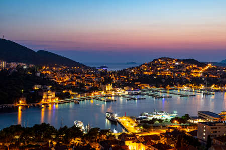 Dubrovnik West harbor Croatia sept 14, 2019: Panoramic view-at night-over the West harbor from the hillside.のeditorial素材