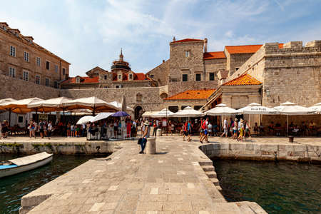 Dubrovnik Croatian Sept. 14 2019: Beautiful sunny day over the bay in front of old town of Dubrovnik as tourists are strolling the ancient city.のeditorial素材