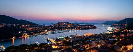 Dubrovnik West harbor Croatia sept 14, 2019: Panoramic view-at night-over the West harbor from the hillside.のeditorial素材