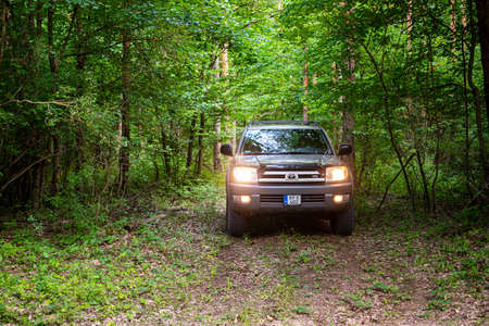 Hungary Bakony mountain range July 9, 2020: Toyota 4Runner SUV touring along on the forestry tracks.