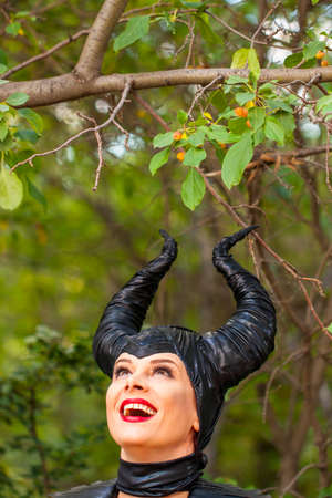 Calgary Canada - Sept 01, 2014: Illustrative cosplayer dressed up as witch with horns. Demonic, dark...