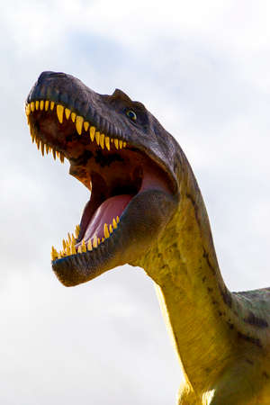 Drumheller, Canada - Mar 27 2016: Visitors flock to the dinosaur exhibits at the entrance of the Royal Tyrrell Museum . The museum is famous for its paleontology research and 130,000 fossils.のeditorial素材