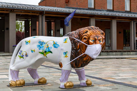 Herend Hungary May 3, 2020: Real size porcelain lion (made by the finest porcelain) dressed with "Face Mask" for COVID 19 health issue.のeditorial素材