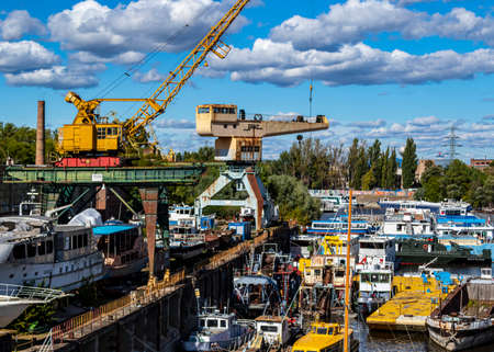 Budapest Hungary Oct. 24, 2020: Old shipyard and boats. Dismounting dock. Vintage river cruisers and pleasure craft are maintained and dismounted here.のeditorial素材