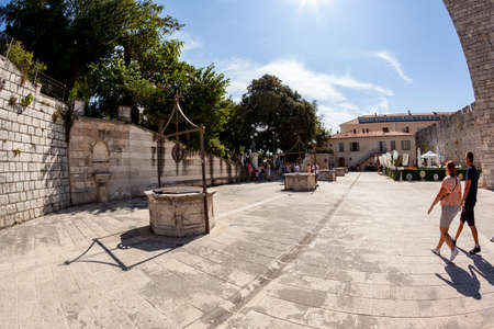 Zadar, Croatia 09 17 2019: Jurja Barakovica street and the nearby square with visitors, one of the main streets in the old town of Zadar, Croatiaのeditorial素材