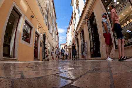 Zadar, Croatia 09 17 2019: Narrow streets, public squares and people of old town of Zadar. Historical buildings and souvenir shops.のeditorial素材