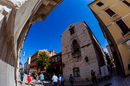 Zadar, Croatia 09 17 2019: Narrow streets, public squares and people of old town of Zadar. Historical buildings and souvenir shops.のeditorial素材
