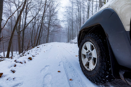 KÃ©kes  Hungary Dec.  27, 2020: An off-road vehicle Toyota 4Runner in the foggy snow covered forest.のeditorial素材