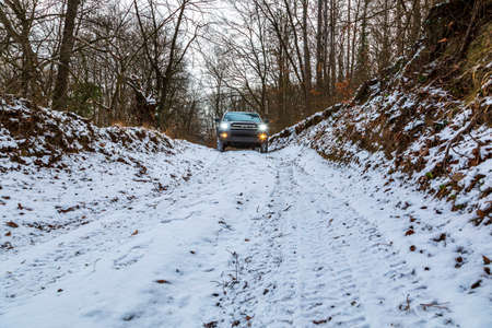 Gerencse Central Mountain range Hungary January 17, 2021: A gold color Luxury SUV 4x4 Toyota 4...