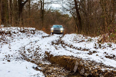 Gerencse Central Mountain range Hungary January 17, 2021: A gold color Luxury SUV 4x4 Toyota 4...