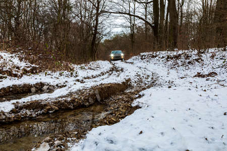 Gerencse Central Mountain range Hungary January 17, 2021: A gold color Luxury SUV 4x4 Toyota 4 Runner parked in the snow covered winter forest somewhere in in Central Europe. Winter 4x4 safari.のeditorial素材