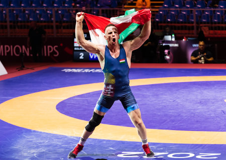 Budapest Hungary - Apr. 3, 2022: - Bolkvadze S. GEO - Fritsch R. HUN compete in the E.U. Man Wrestling Championship Budapest Hungary. With a Hungarian Gold medal.のeditorial素材