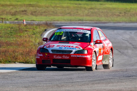 Kakucs Hungary - October 15th 2022: European Rallycross championship modified rally car driving on slalom course at the international rally event.のeditorial素材
